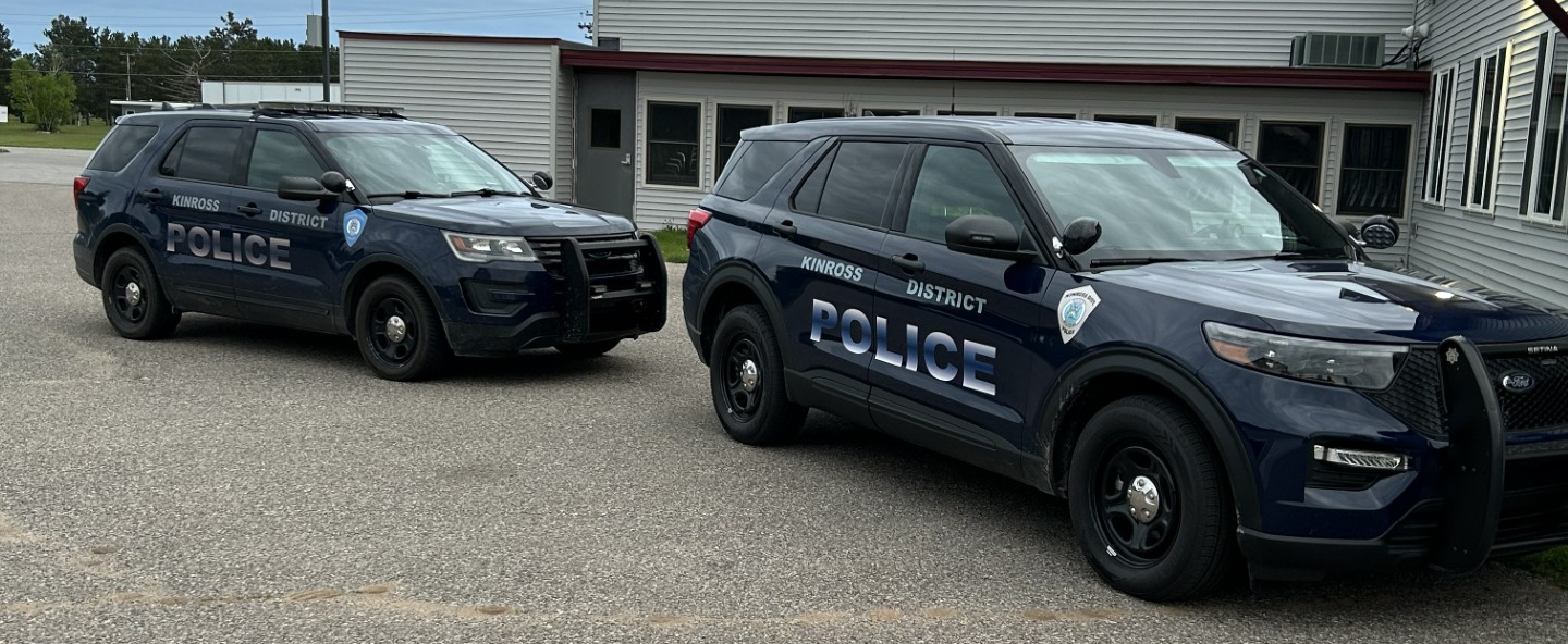 Kinross District Police SUVs parked outside a station.